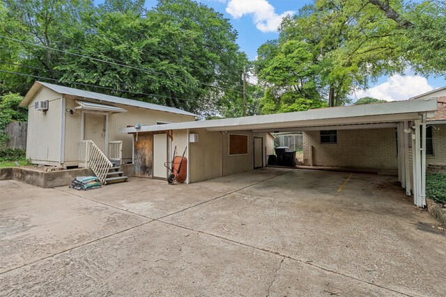 120 Wooded Crest Dr, Woodway, TX 76712 - view of front of home with a carport, concrete driveway, and brick siding