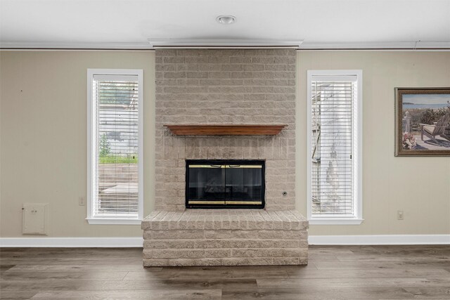 120 Wooded Crest Dr, Woodway, TX 76712 - unfurnished living room with baseboards, wood finished floors, crown molding, and a fireplace
