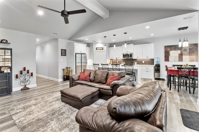 4518 Velta Ln, Abilene, TX 79606 - living room featuring light wood-style floors, recessed lighting, ceiling fan, baseboards, and a chandelier
