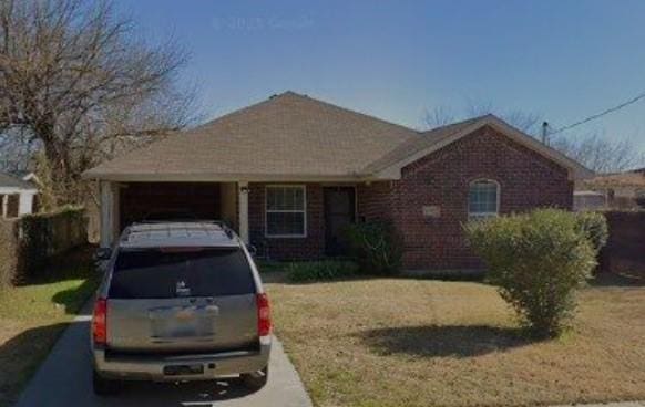 4022 Ladale Dr, Dallas, TX 75212 - view of front of house with a front lawn, an attached carport, and brick siding