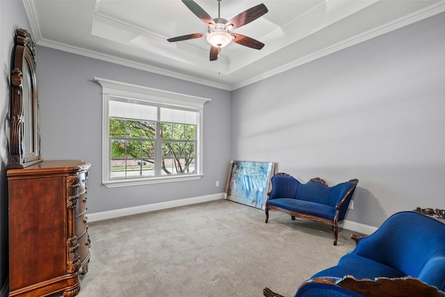 7305 Kingsbarns, The Colony, TX 75056 - living area with a tray ceiling, ornamental molding, carpet flooring, ceiling fan, and baseboards