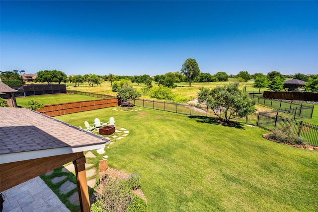 7305 Kingsbarns, The Colony, TX 75056 - view of yard with an outdoor fire pit and a rural view