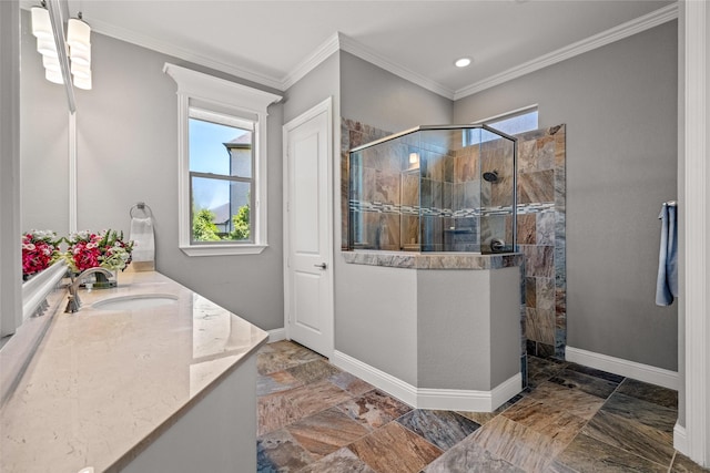 7305 Kingsbarns, The Colony, TX 75056 - bathroom with vanity, walk in shower, ornamental molding, baseboards, and stone finish flooring