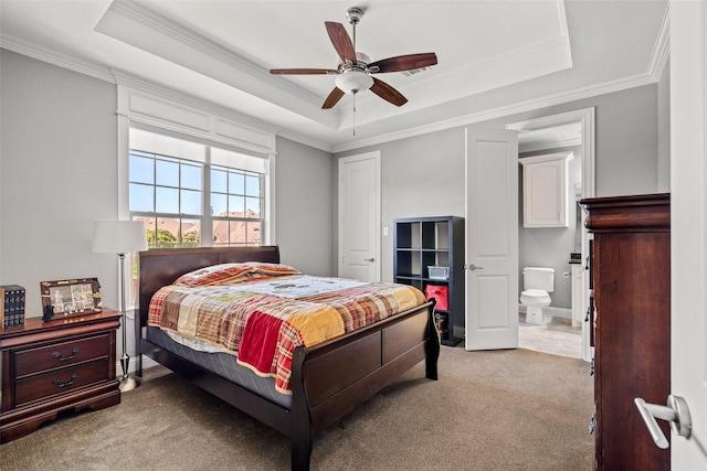 7305 Kingsbarns, The Colony, TX 75056 - bedroom with ornamental molding, a tray ceiling, light colored carpet, connected bathroom, and a ceiling fan