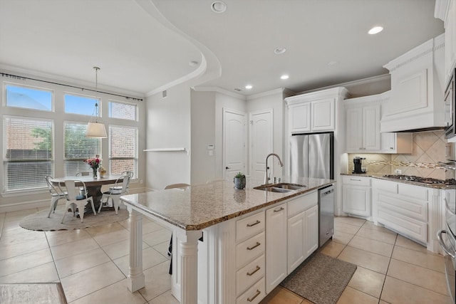 4219 Bal Harbour Ln, Frisco, TX 75033 - kitchen with a sink, appliances with stainless steel finishes, ornamental molding, light tile patterned floors, and light stone countertops