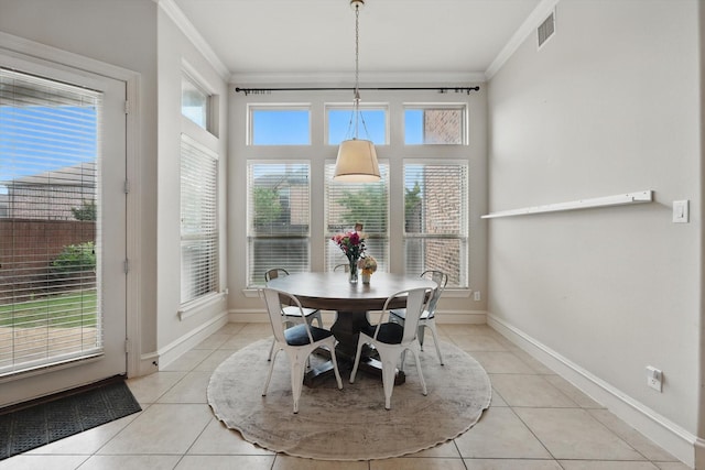 4219 Bal Harbour Ln, Frisco, TX 75033 - dining area featuring crown molding, light tile patterned floors, and baseboards