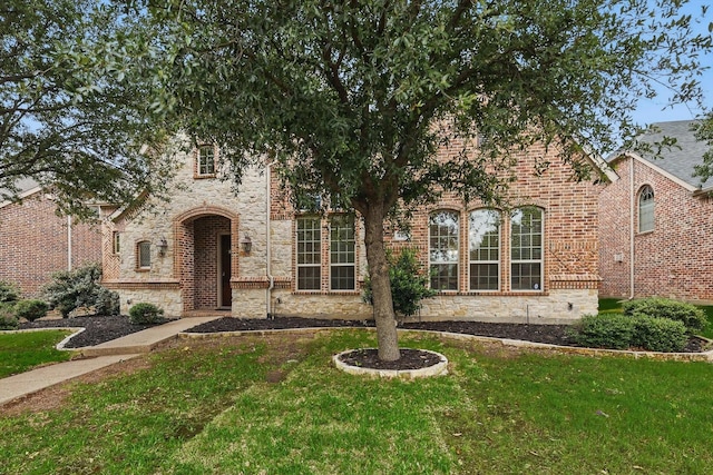 4219 Bal Harbour Ln, Frisco, TX 75033 - view of front of home with a front lawn and brick siding