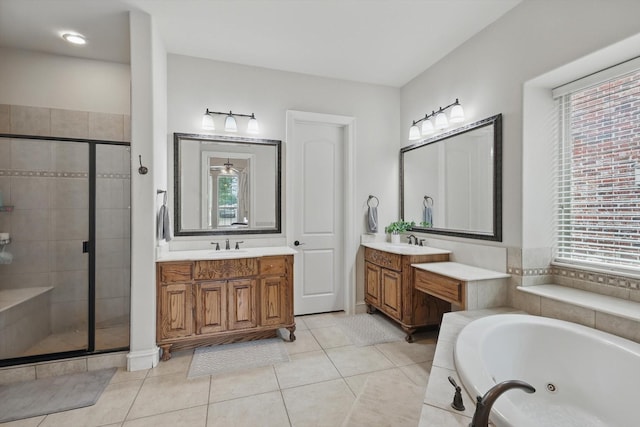 4219 Bal Harbour Ln, Frisco, TX 75033 - full bathroom featuring a stall shower, a tub with jets, two vanities, and tile patterned flooring