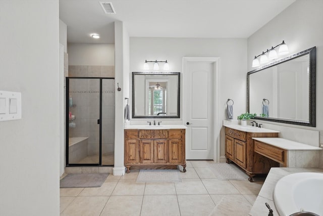 4219 Bal Harbour Ln, Frisco, TX 75033 - bathroom featuring a stall shower, two vanities, tile patterned floors, and a bath