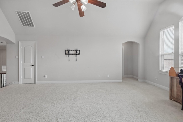 4219 Bal Harbour Ln, Frisco, TX 75033 - unfurnished living room with arched walkways, lofted ceiling, a ceiling fan, light colored carpet, and baseboards