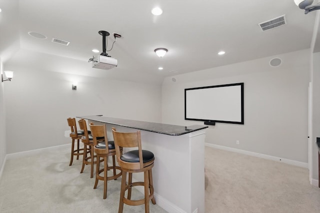 4219 Bal Harbour Ln, Frisco, TX 75033 - home theater with light colored carpet, a dry bar, recessed lighting, and baseboards
