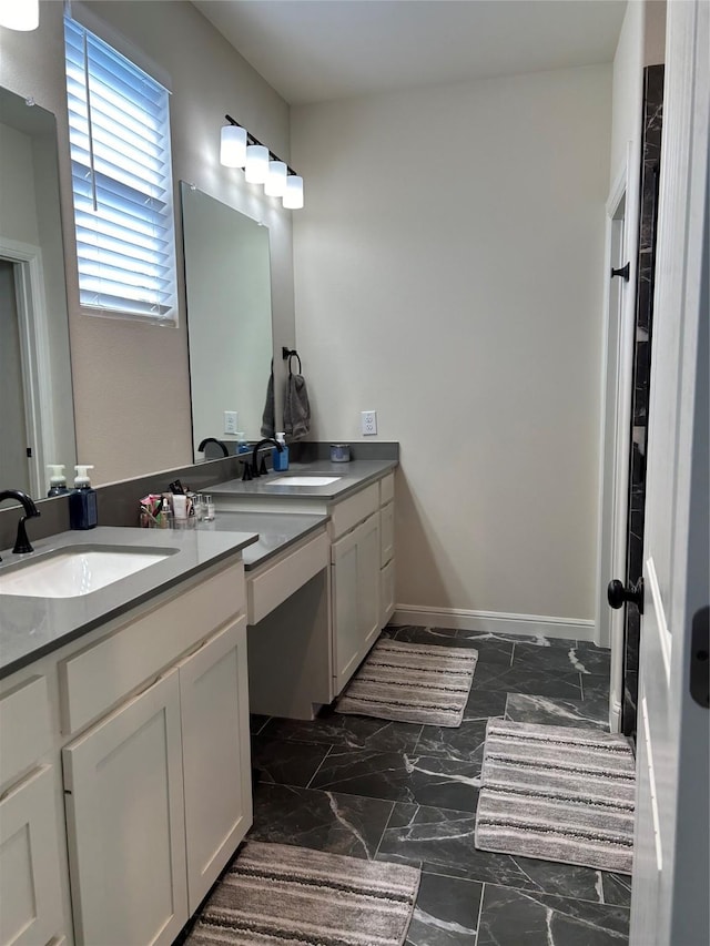 140 Hummingbird Dr, Weatherford, TX 76088 - full bath with vanity, marble look tiles, and baseboards