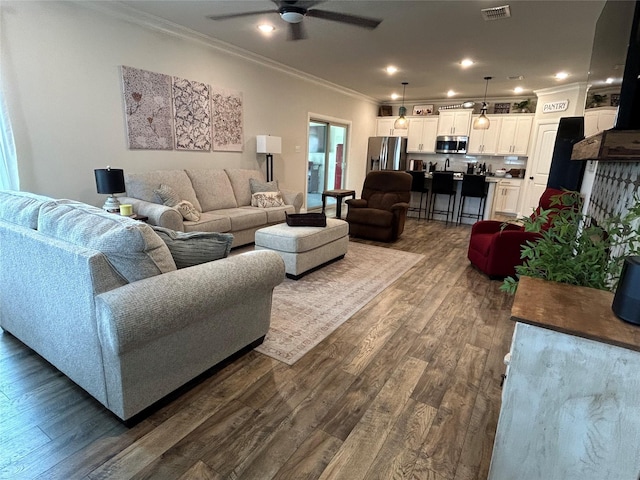 140 Hummingbird Dr, Weatherford, TX 76088 - living area featuring crown molding, a ceiling fan, dark wood-type flooring, and recessed lighting