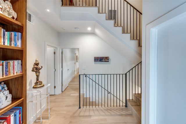 3645 Reagan St, Dallas, TX 75219 - stairs featuring recessed lighting and wood finished floors