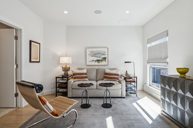 3645 Reagan St, Dallas, TX 75219 - sitting room with wood finished floors, recessed lighting, and baseboards