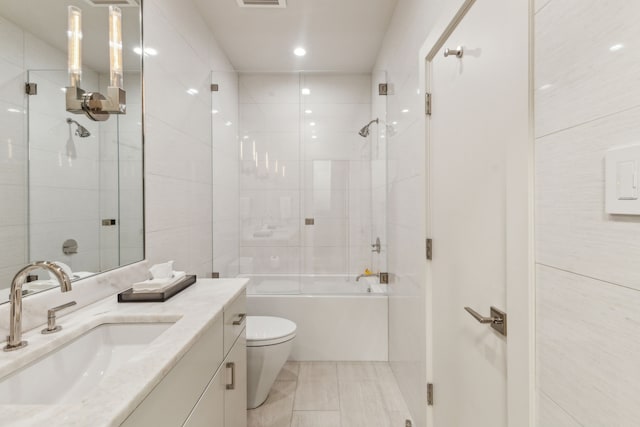 3645 Reagan St, Dallas, TX 75219 - bathroom featuring vanity, toilet, shower / bath combination, and recessed lighting