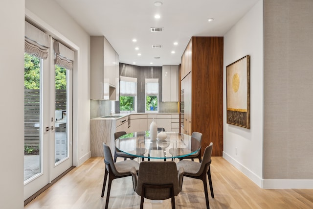 3645 Reagan St, Dallas, TX 75219 - dining area with light wood finished floors, baseboards, and recessed lighting