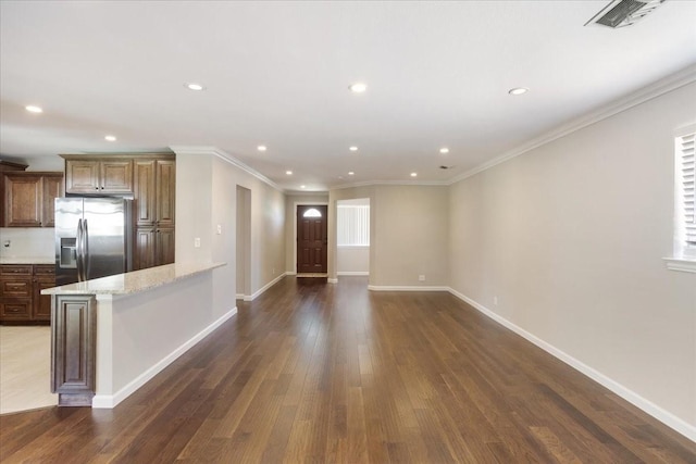 131 S Imperial Dr, Denison, TX 75020 - kitchen featuring stainless steel fridge with ice dispenser, recessed lighting, dark wood-type flooring, baseboards, and ornamental molding