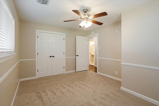 131 S Imperial Dr, Denison, TX 75020 - unfurnished bedroom with a closet, carpet flooring, baseboards, and a ceiling fan
