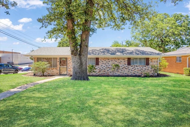 131 S Imperial Dr, Denison, TX 75020 - ranch-style home featuring brick siding and a front yard
