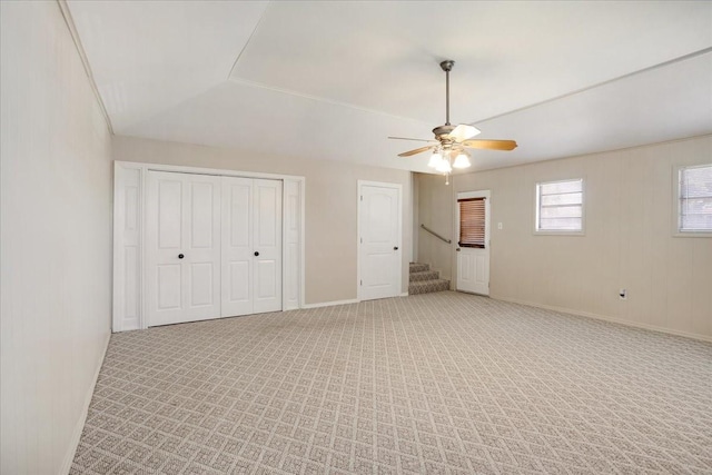 131 S Imperial Dr, Denison, TX 75020 - unfurnished bedroom with light colored carpet, baseboards, ceiling fan, and a closet