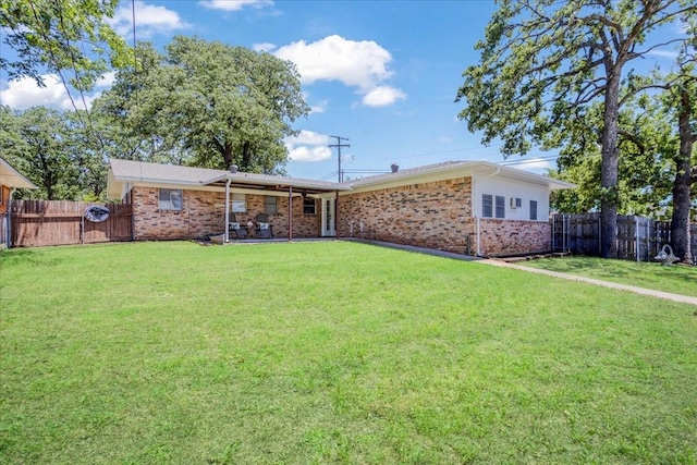 131 S Imperial Dr, Denison, TX 75020 - rear view of house with brick siding