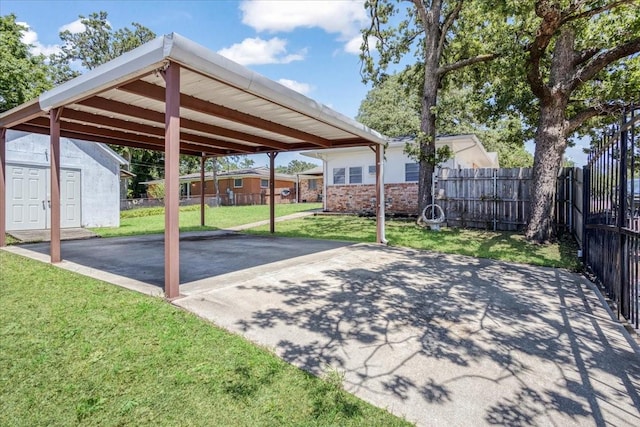 131 S Imperial Dr, Denison, TX 75020 - view of patio with driveway and a detached carport
