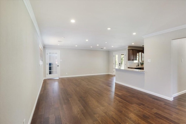 131 S Imperial Dr, Denison, TX 75020 - unfurnished living room with ornamental molding, dark wood-style flooring, a sink, recessed lighting, and baseboards