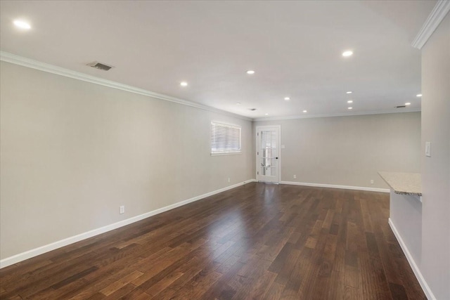131 S Imperial Dr, Denison, TX 75020 - spare room with ornamental molding, dark wood-style floors, baseboards, and recessed lighting