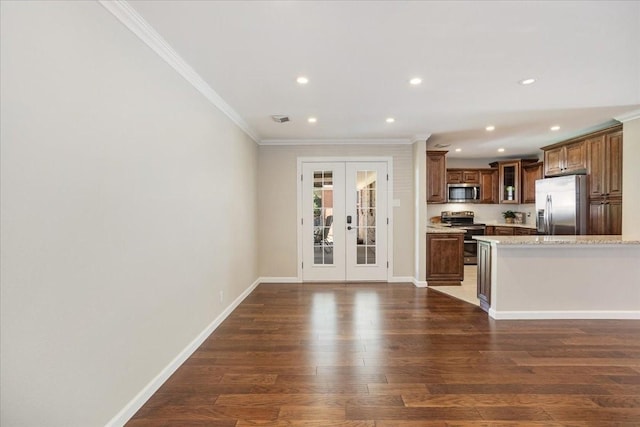 131 S Imperial Dr, Denison, TX 75020 - kitchen featuring stainless steel appliances, ornamental molding, french doors, dark wood finished floors, and recessed lighting