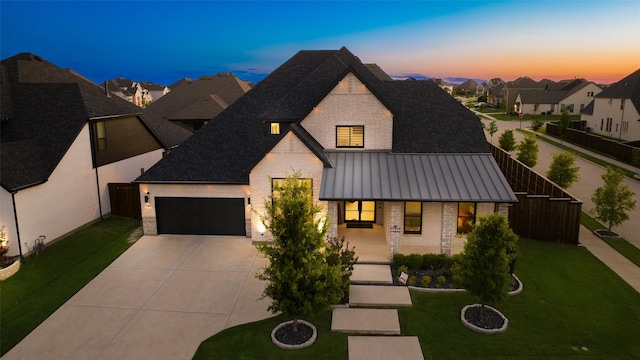 1907 Cedar Bluff Pkwy, Mansfield, TX 76063 - view of front facade featuring brick siding, driveway, covered porch, and a front lawn