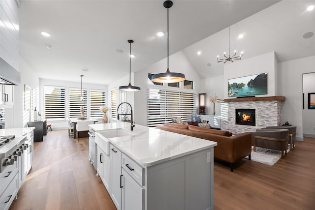 1907 Cedar Bluff Pkwy, Mansfield, TX 76063 - kitchen featuring a chandelier, a sink, light wood finished floors, white cabinetry, and recessed lighting