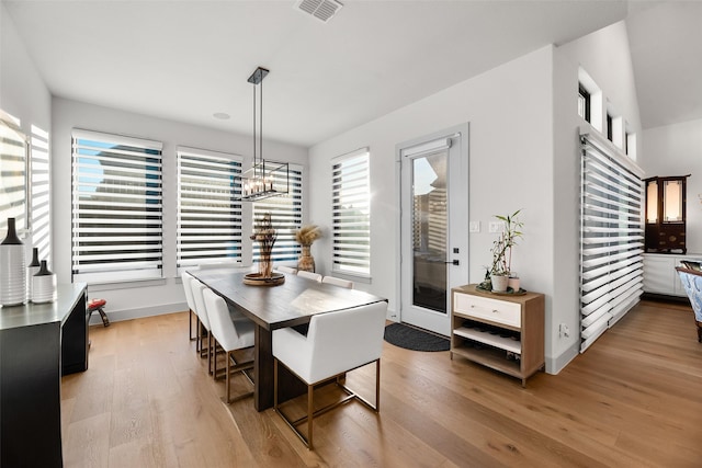 1907 Cedar Bluff Pkwy, Mansfield, TX 76063 - dining room with light wood-style floors, a chandelier, and baseboards