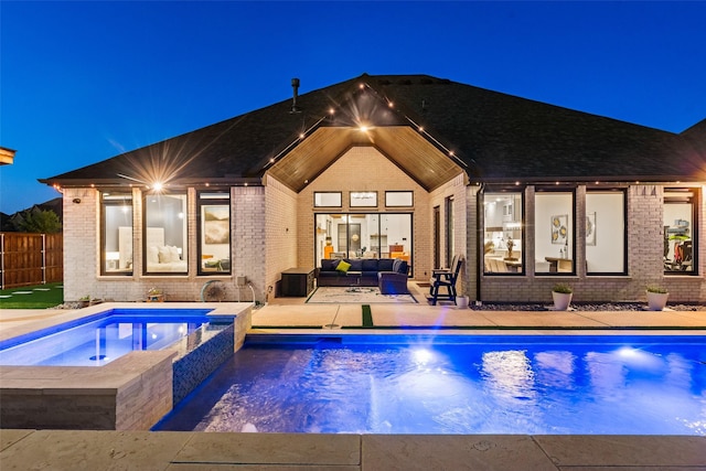 1907 Cedar Bluff Pkwy, Mansfield, TX 76063 - pool at night featuring an outdoor hangout area, a patio area, and a pool with connected hot tub