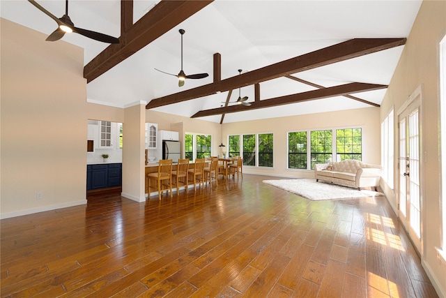 635 E Tripp Rd, Sunnyvale, TX 75182 - living room featuring ceiling fan, beamed ceiling, high vaulted ceiling, baseboards, and wood finished floors
