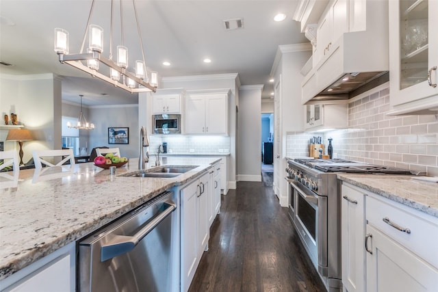 4008 N Cresthaven Rd, Dallas, TX 75209 - kitchen featuring stainless steel appliances, ornamental molding, a sink, white cabinets, and decorative backsplash