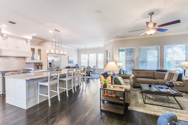 4008 N Cresthaven Rd, Dallas, TX 75209 - living room with dark wood finished floors, ceiling fan, ornamental molding, and recessed lighting