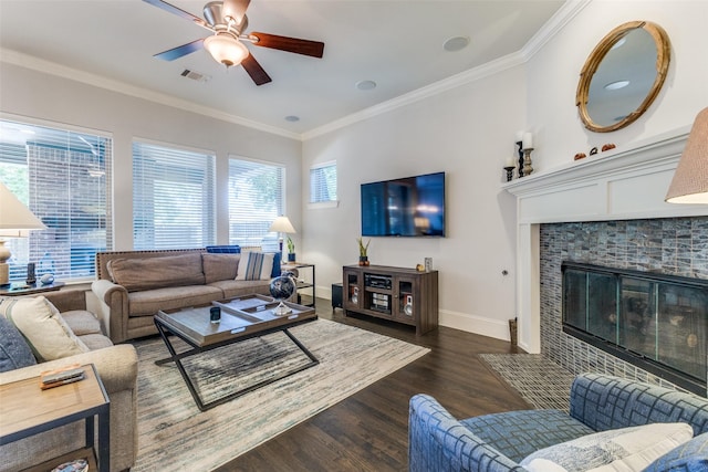 4008 N Cresthaven Rd, Dallas, TX 75209 - living room with ornamental molding, ceiling fan, dark wood-type flooring, baseboards, and a tiled fireplace