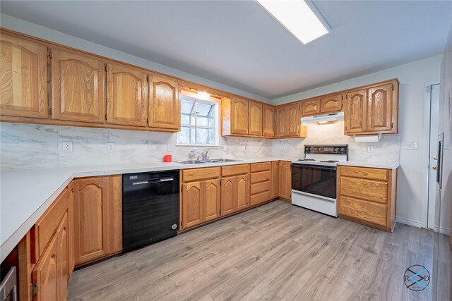 208 Lynn Creek Cv, Mabank, TX 75156 - kitchen featuring white range with electric cooktop, black dishwasher, a sink, under cabinet range hood, and light wood-type flooring
