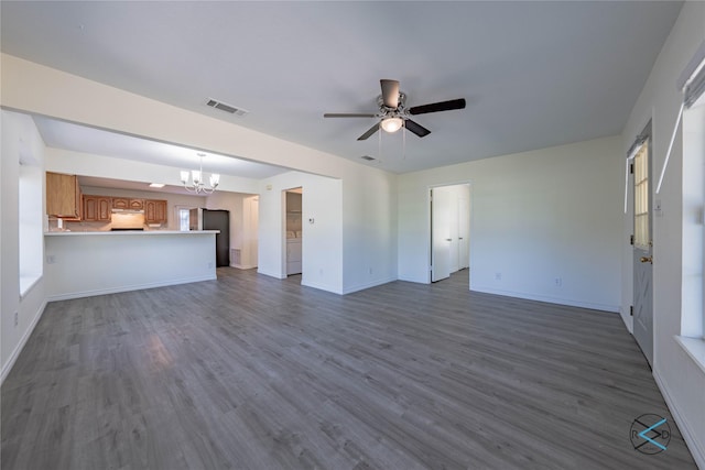 208 Lynn Creek Cv, Mabank, TX 75156 - unfurnished living room featuring a chandelier, a ceiling fan, baseboards, and dark wood finished floors
