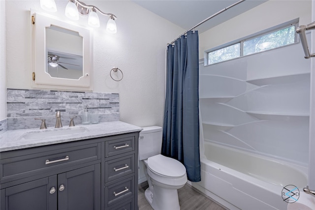 208 Lynn Creek Cv, Mabank, TX 75156 - full bathroom featuring toilet, vanity, shower / bathtub combination with curtain, wood finished floors, and backsplash