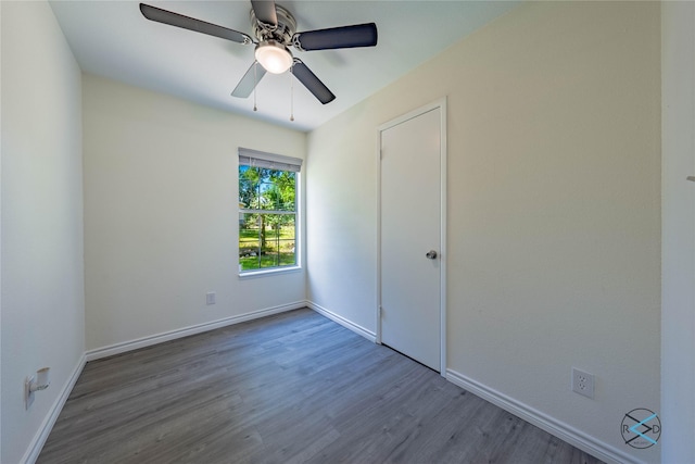 208 Lynn Creek Cv, Mabank, TX 75156 - unfurnished bedroom with wood finished floors, baseboards, and a ceiling fan