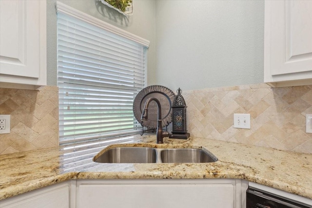 160 Brandy Hill Rd, Lorena, TX 76655 - kitchen view of a sink, dishwashing machine, decorative backsplash, white cabinetry, and light stone countertops