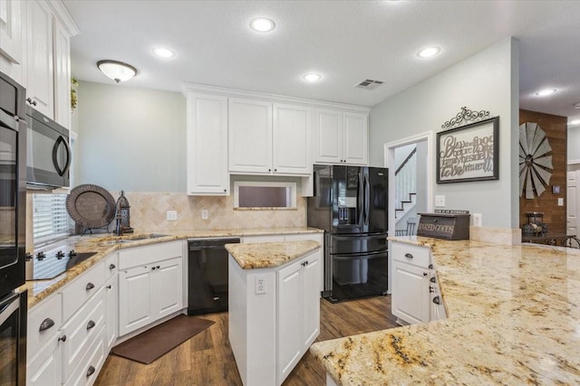 160 Brandy Hill Rd, Lorena, TX 76655 - kitchen with black appliances, a sink, dark wood-type flooring, white cabinets, and recessed lighting