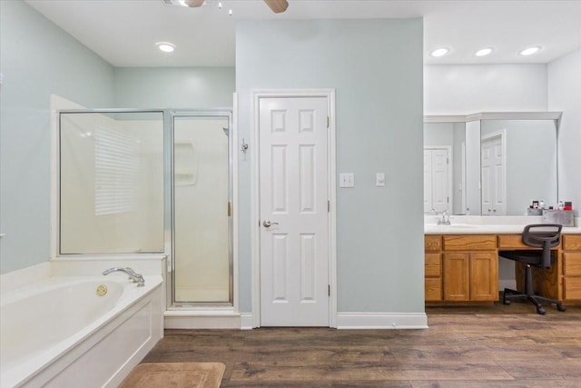 160 Brandy Hill Rd, Lorena, TX 76655 - bathroom featuring a shower stall, a garden tub, wood finished floors, vanity, and recessed lighting