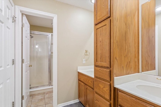 160 Brandy Hill Rd, Lorena, TX 76655 - full bathroom with vanity, a stall shower, tile patterned flooring, and baseboards