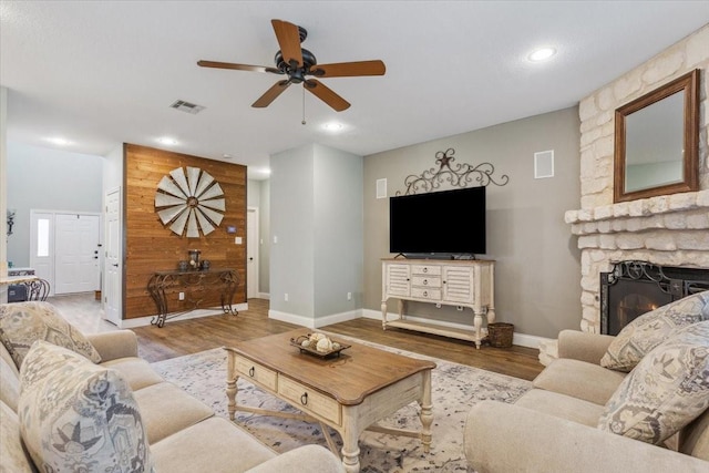 160 Brandy Hill Rd, Lorena, TX 76655 - living room featuring ceiling fan, wood finished floors, baseboards, a stone fireplace, and recessed lighting