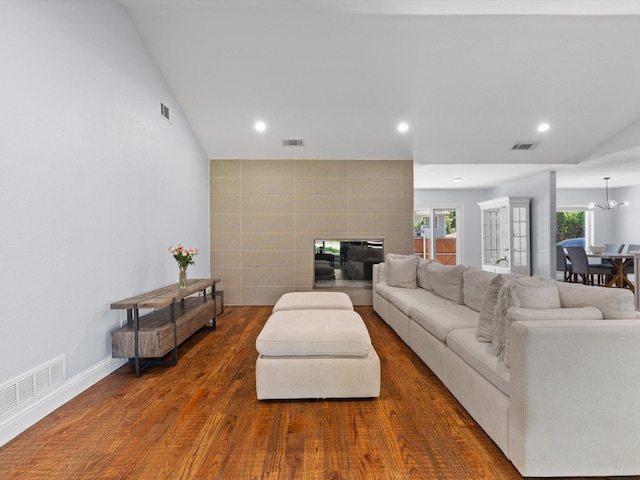 7724 Meadowhaven Dr, Dallas, TX 75254 - living room featuring recessed lighting, a chandelier, wood finished floors, lofted ceiling, and a tiled fireplace