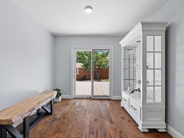 7724 Meadowhaven Dr, Dallas, TX 75254 - doorway featuring baseboards and dark wood-type flooring