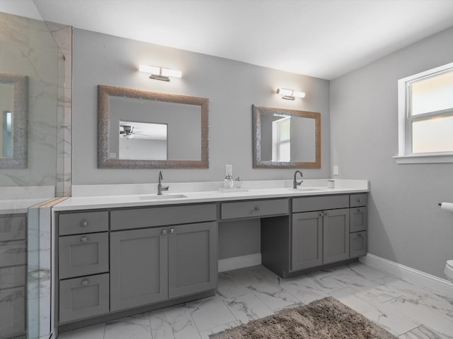 7724 Meadowhaven Dr, Dallas, TX 75254 - bathroom with marble look tiles, double vanity, baseboards, a marble finish shower, and toilet